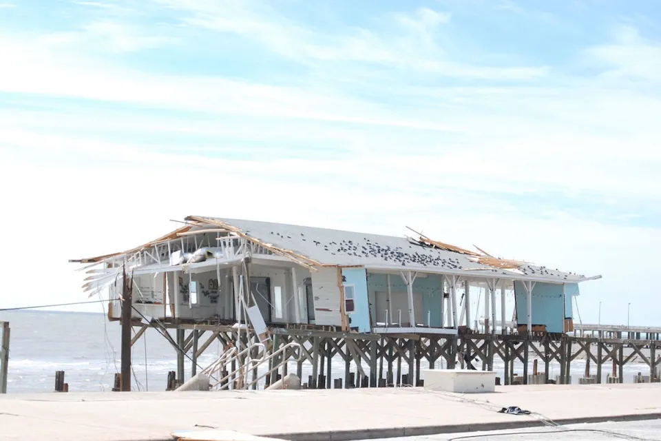 damaged building on pier in Gulf of Mexico in Galveston, Texas after Hurricane Ike.